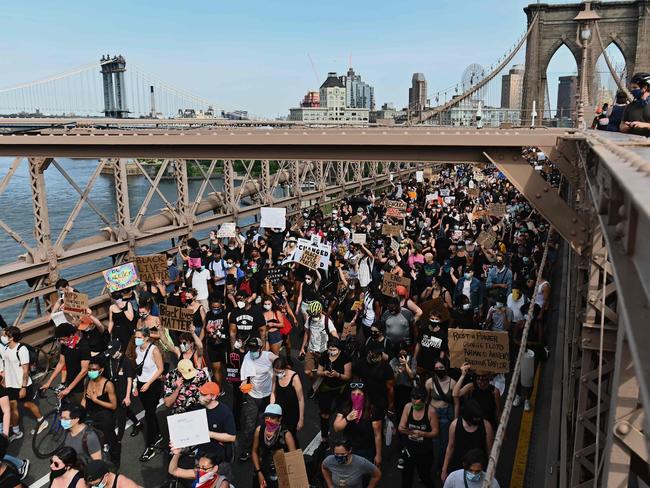 Thousands of protesters march over the Brooklyn Bridge to demonstrate against the death of George Floyd in New York. Picture: AFP