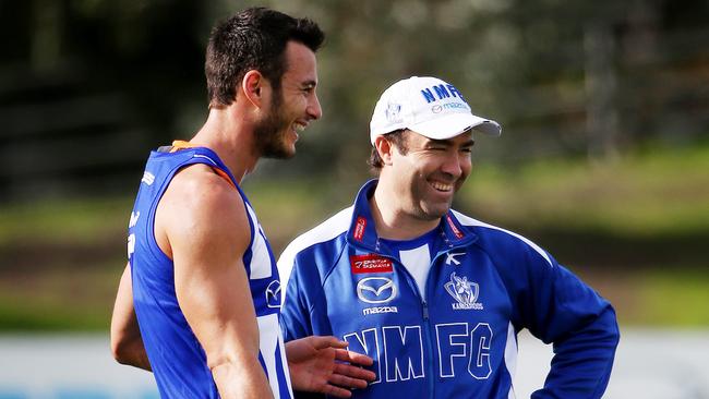 Kangaroos training at Arden St , Robbie Tarrant has a chat with Coach Brad Scott. June 11th 2014. Picture : Colleen Petch