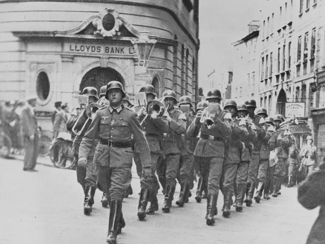 Occupying Britain’s isles … German soldiers march through Guernsey, one of Jersey’s neighbouring Channel Islands, in 1940.