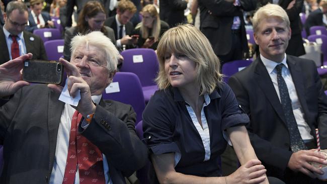 Stanley Johnson takes a selfie with Rachel as Jo looks on after Boris Johnson is announced as Prime Minister. Picture: AP.