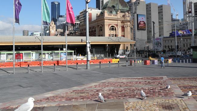 Normally bustling Federation Square was empty save for a few seagulls this morning. Picture: David Crosling