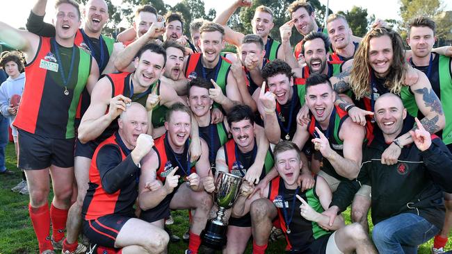 Aquinas celebrates with the silverware  Picture: Andy Brownbill