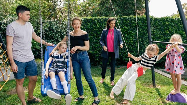 Josie Fishwick, 12, has the rare genetic condition FOXG1. Here she is pictured with her parents Scott and Sara Fishwick, aunt and author of this story Natasha Robinson, and sisters Alice and Isabelle. Picture: Max Mason-Hubers