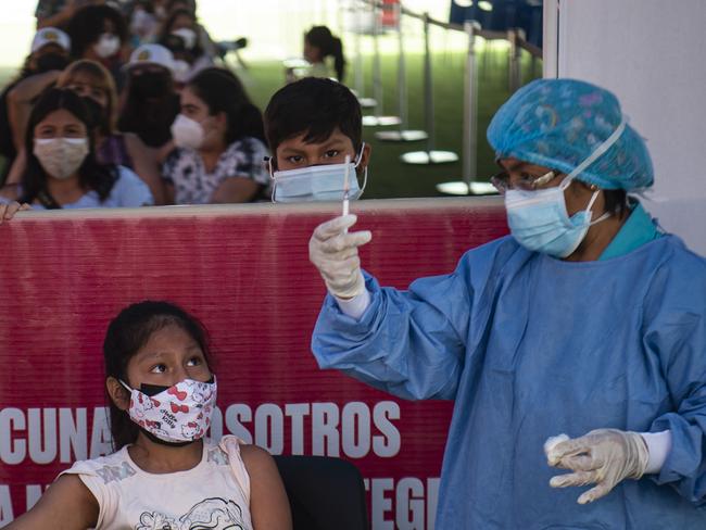 A health worker prepares to inoculate a child in the five to 11 age bracket with a dose of the Pfizer vaccine in Lima, Peru. Picture: AFP