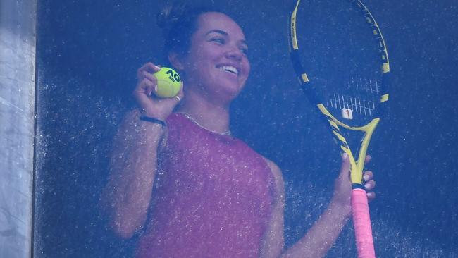 American tennis player Desirae Krawczyk looks out from an Australian Open quarantine hotel in Melbourne. Picture: William West/AFP