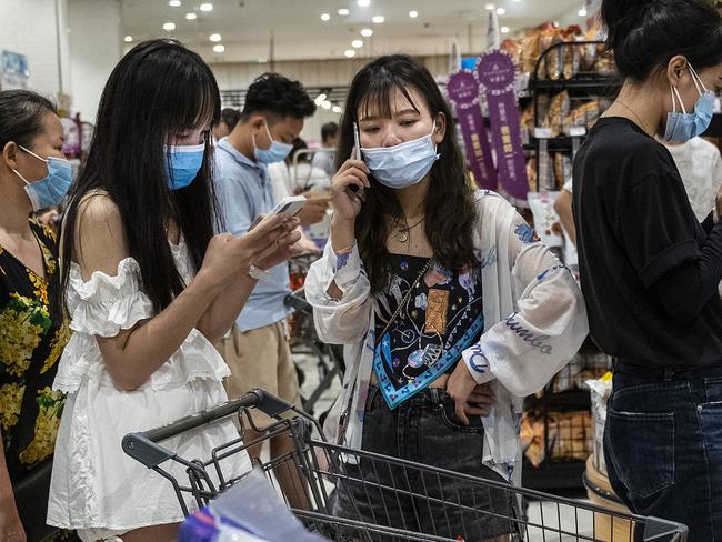 WUHAN, CHINA - AUGUST 2Ã¯Â¼Å¡(CHINA OUT) People wear protective masks as they line up to pay in a supermarket on August 2, 2021 in Wuhan, Hubei Province, China. According to media reports, seven migrant workers returned positive COVID-19 nucleic acid tests. Wuhan has not reported locally transmitted cases for over a year.  (Photo by Getty Images)