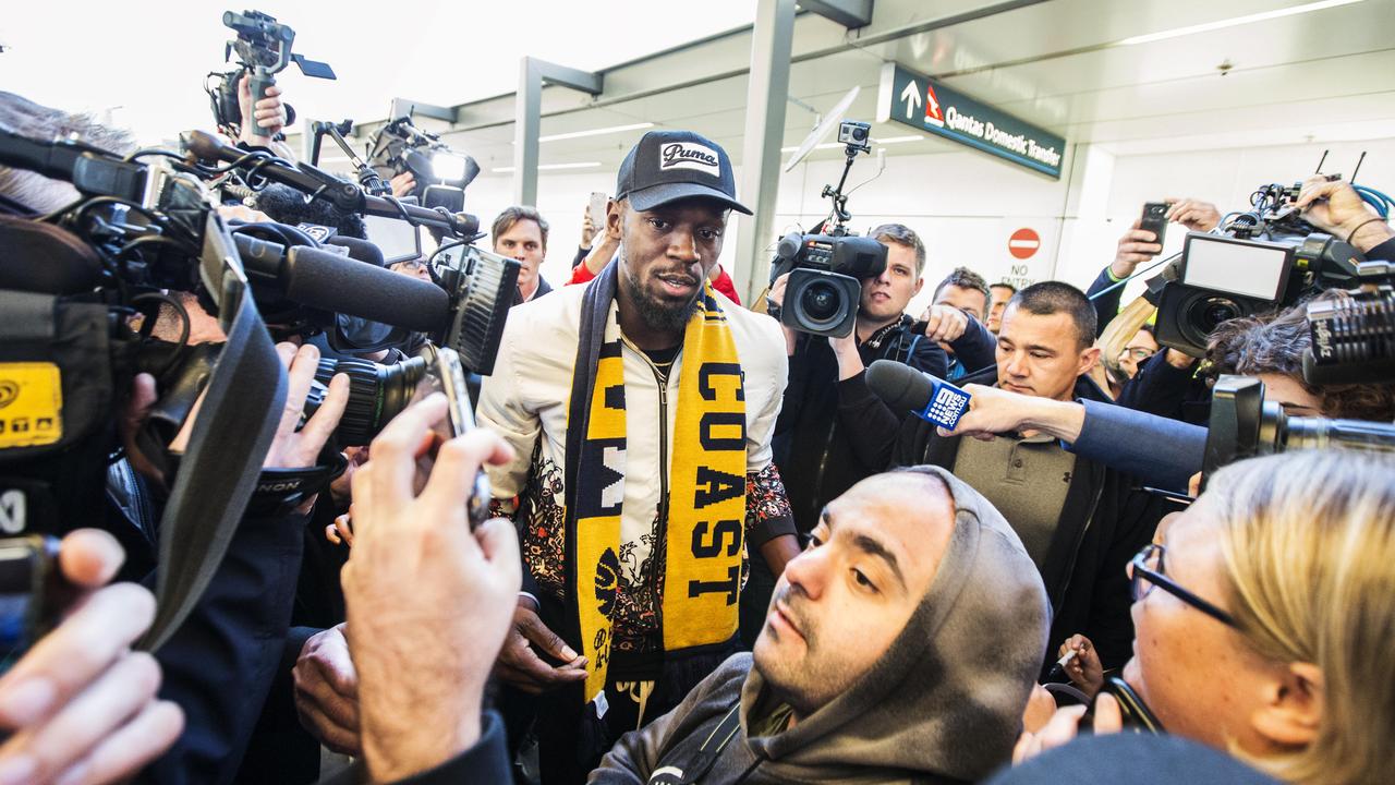 Usain Bolt arrives at Sydney International airport.
