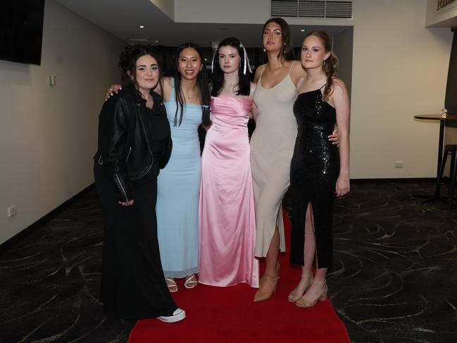 MELBOURNE, AUSTRALIA – JUNE 14 2024 Satyne Coppock, Irene Lim, Bianca McCutcheon, Olivia Gallus, Zoe Cotter attend the Lowanna College Senior Formal 2024 at the Moe Racing Club Picture: Brendan Beckett