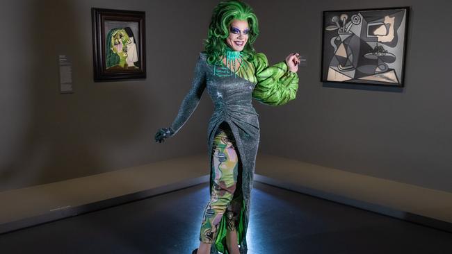 Drag queen Art Simone in her Weeping Woman dress next to the painting on show at NGV International’s Picasso Century exhibition. Picture: Jason Edwards