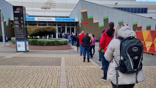 People see lining up to get their vaccination at the Wayville Showgrounds Vaccination Hub on Monday morning, July 11, 2022. Picture: Greg Barila