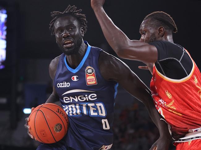 MELBOURNE, AUSTRALIA - FEBRUARY 11: Jo Lual-Acuil Jr of United in action under pressure from Mangok Mathiang of the Breakers during the round 19 NBL match between Melbourne United and New Zealand Breakers at John Cain Arena, on February 11, 2024, in Melbourne, Australia. (Photo by Daniel Pockett/Getty Images)