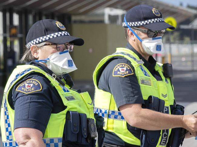 JQ707 arrives at Hobart from Melbourne, police prepare for arrival. Picture Chris Kidd