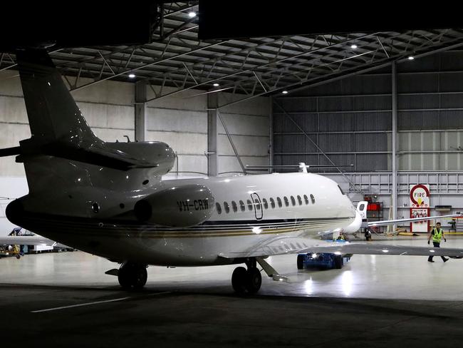 The plane entered hangar 9 at around 8.45pm. Picture: AFP