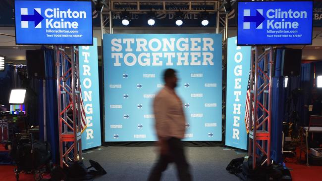 A man walks past a Hillary Clinton spin room studio before the second presidential debate between Republican presidential nominee Donald Trump and Democratic rival Hillary Clinton at Washington University in St Louis, Missouri. Picture: Mandel Ngan