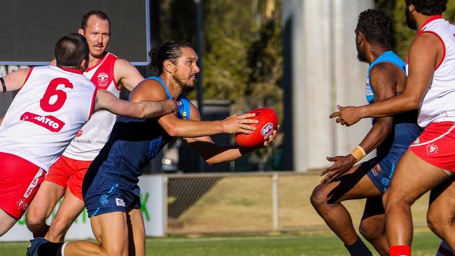 Cameron Ilett evades a nest of Demons last week. Picture: Charlie Lowson