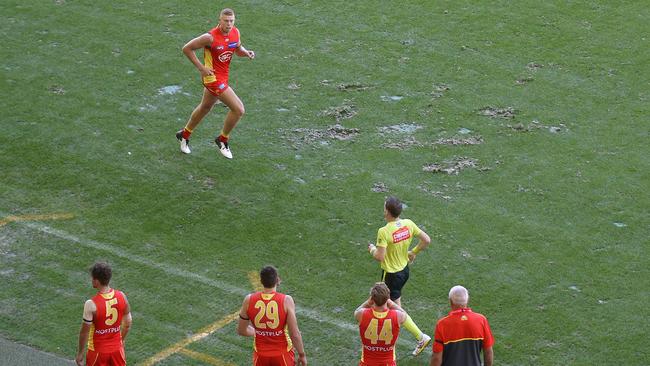 Divots in the Marvel Stadium surface in front of the interchange bench. Picture: Michael Klein.