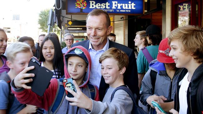 Member for Warringah Tony Abbott poses for selfies with schoolchildren in Mosman. Picture: Annika Enderborg