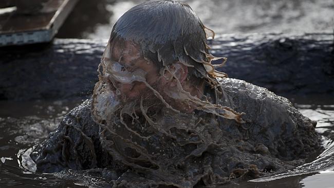 The just-emerged-from-the-surf hair flick loses its sexiness in a huge puddle of mud, right?