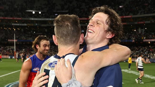 Joel Selwood hugs Max Holmes. He described his injury as ‘so sad.’ Picture by Michael Klein