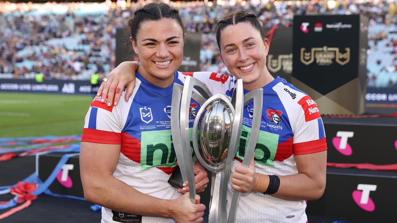 Millie Boyle and Romy Teitzel celebrate the Knights’ 2022 NRLW grand final win. Picture: Cameron Spencer/Getty Images