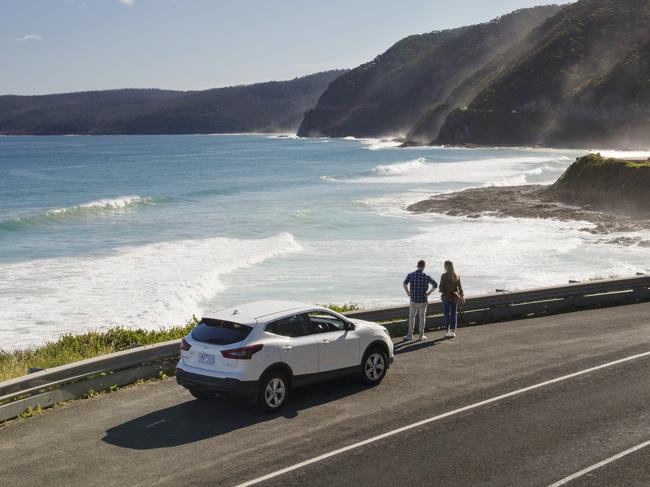 ESCAPE: Couple, Car, Great Ocean Road. Picture: Visit Victoria