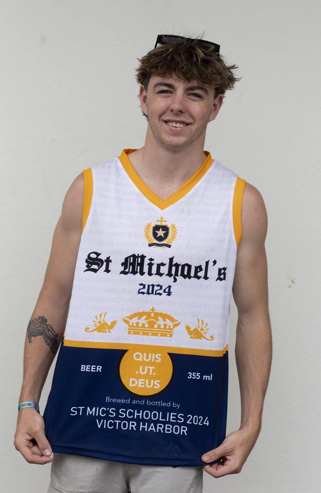 St Mic’s students including Elliot Stubing, 17, featured their school’s crest and motto on their Corona Extra inspired tops. Picture: Brett Hartwig