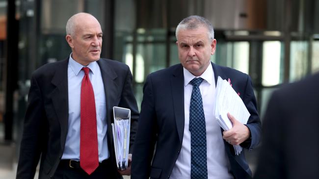 Freedom Insurance chief operating officer Craig Orton, right, leaves the banking royal commission in Melbourne. Picture : David Geraghty