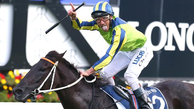 Jockey Damien Oliver on Lucia Valentina celebrates as they win the Longines Queen Elizabeth Stakes race during The Championships - Day 2 Longines Queen Elizabeth Stakes Day at Royal Randwick racecourse in Sydney, Saturday, April 9, 2016. (AAP Image/David Moir) NO ARCHIVING, EDITORIAL USE ONLY