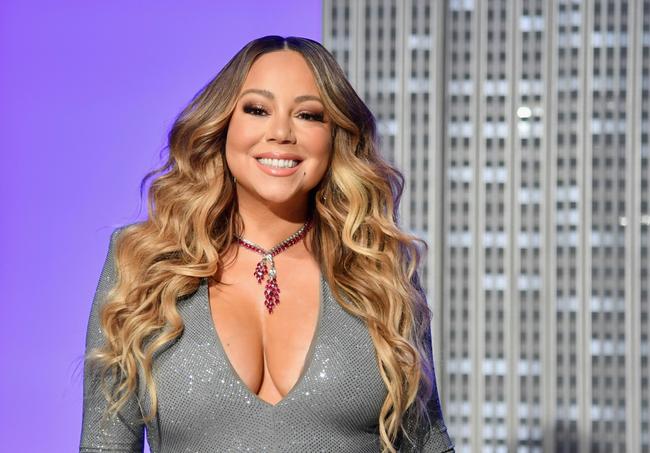 Christmas icon Mariah Carey held her festive excitement  to tell voters: 'It's voting season'