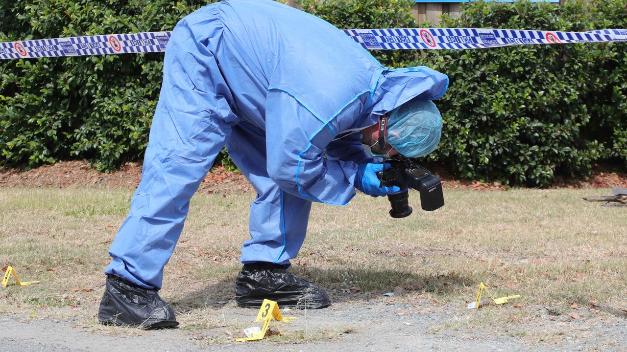 Police at the murder scene. Picture Glenn Hampson