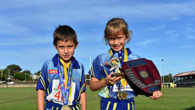 Athletics - Under 7 boys age champion and Friday Night Competition under 7 boys winner Hunter Jacobson and under 7 girls age champion, Adam and Courtney Cross Shields winner under 7 and Friday Night competition winner Piper Wilson. Picture: Bec Singh