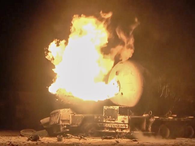 In this photo taken from video released by Al Masirah TV channel shows a burning oil tanker after U.S. airstrikes targeted the Ras Isa oil port held by Yemen's Houthi rebels in Hodeida, Yemen, Friday, April 18, 2025.( Al Masirah TV via AP)