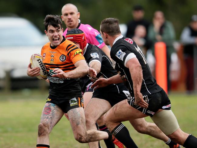 Picton Magpies take on  The Oaks Tigers at Dudley Chesham Sportsground , The Oaks. Tigers Bryce Hoskin takes on the Magpies defence