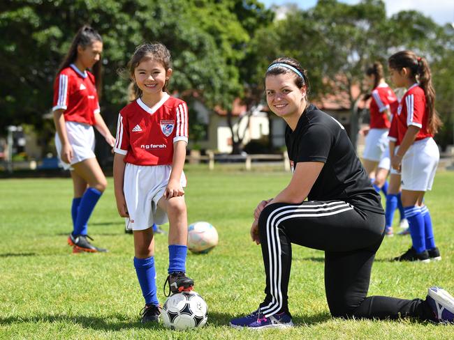 Pagewood Botany Football Club members Erin Jones and Coach Julia Chernoukha pose for a photo at Jellicoe Park in Pagewood, Sydney, Saturday, Nov. 11, 2017. (AAP Image/Joel Carrett)