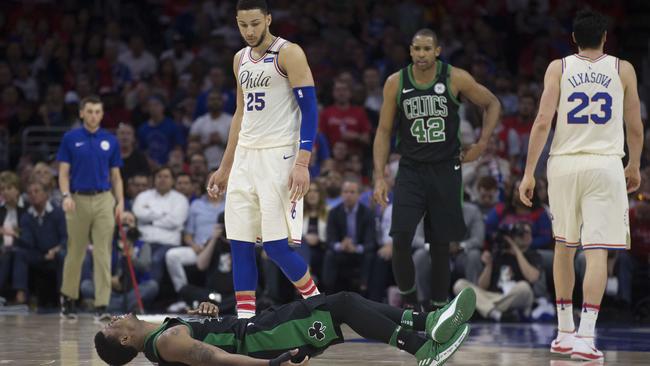 Ben Simmons (#25) of the Philadelphia 76ers looks down at Marcus Smart of the Boston Celtics after the players collided in the second quarter. Photo: Getty Images