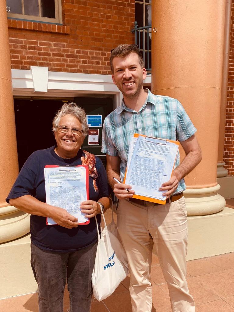 Ellen Neuss and Councillor Paul Truscott with the petition to build a footpath in Jupiter Street, Maryborough.