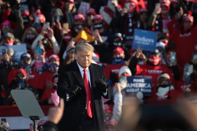 Donald Trump, shown here dancing to a Village People song as he wraps up a campaign rally at Green Bay-Austin Straubel International Airport on October 30, 2020 in Green Bay, Wisconsin