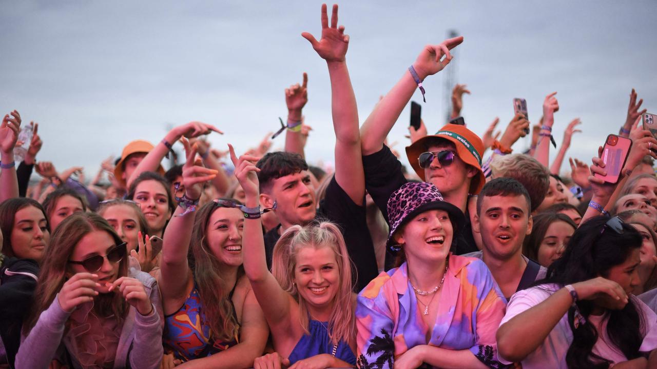 Festival-goers watch British rapper AJ Tracey perform on stage at Reading Festival. As Covid-19 infection levels rise across the country, vaccines were offered to revellers throughout the weekend. Picture: Daniel Leal-Olivas/ AFP