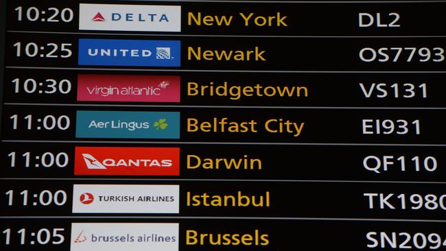 A flight board at Heathrow shows a non-stop flight from London to Darwin, QF110, a repatriation flight for stranded Australians stuck across Europe. Picture: Annabel Moeller / The Australian