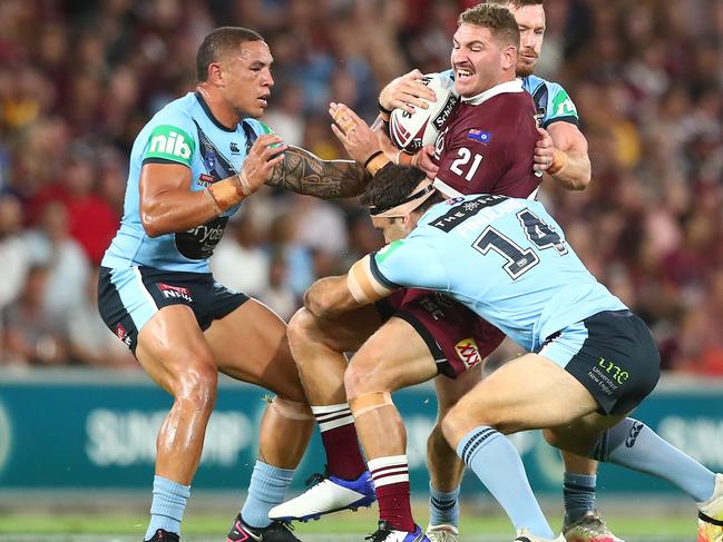 BRISBANE, AUSTRALIA - NOVEMBER 18: Brenko Lee of the Maroons is tackled during game three of the State of Origin series between the Queensland Maroons and the New South Wales Blues at Suncorp Stadium on November 18, 2020 in Brisbane, Australia. (Photo by Chris Hyde/Getty Images)