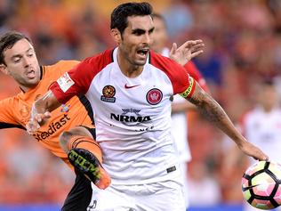 WSW captain Dimas keeping the ball from Tommy Oar. Image: supplied