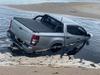 Can’t park there, mate: 4WD goes in the drink at popular Qld beach
