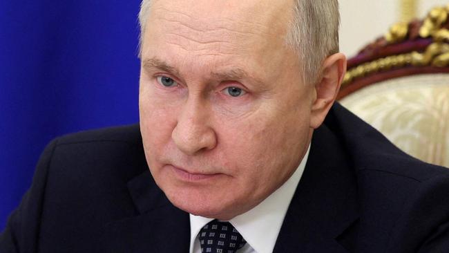 In this pool photograph distributed by Russian state owned agency, Russian President Vladimir Putin chairs a meeting with Russia's Government members via video link in Moscow, on January 17, 2024. (Photo by Gavriil Grigorov / POOL / AFP) / Editor's note : this image is distributed by Russian state owned agency Sputnik