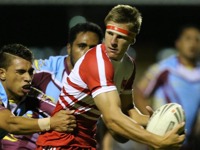 . Keebra Park High v Palm Beach Currumbin rugby league league at Pizzey Park. (PBC in Red stripes)  Jed Cartwright from PBC tackled by Campbell Pirihi in the Keebra defence. Picture Glenn Hampson