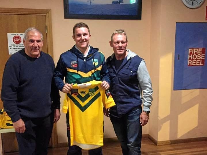 SPECIAL MOMENT: Highfields halfback Jarrod Lee (centre) is presented with his Australian Universities jersey by legends Mick Cronin and Rod Wishart ahead of the Universities Rugby League World Cup in Sydney. Picture: Contributed