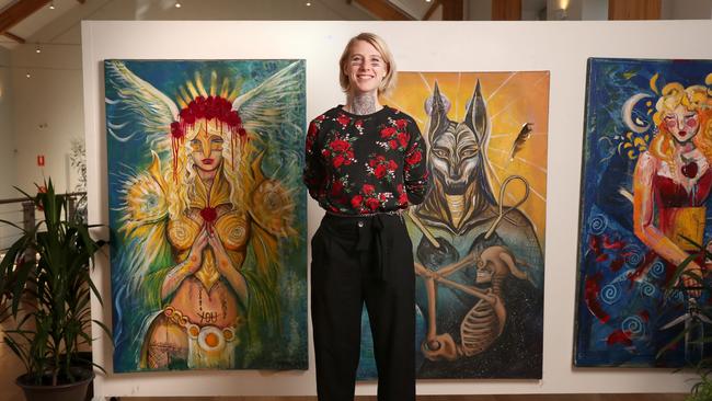 Artist Malachi who has experienced homelessness in the past year with her work that is part of the exhibition. I Am Someone exhibition in Hobart as part of Homelessness Week 2023. Picture: Nikki Davis-Jones