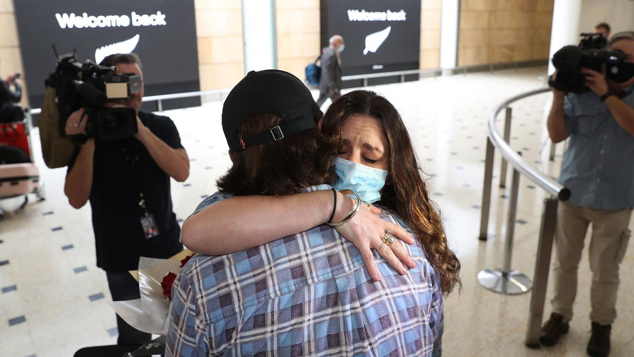 Jayden Guest greets his girlfriend Taren Kowalski on arrival. Picture: Brett Costello