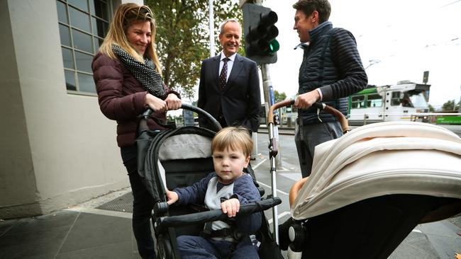 Bill Shorten talks with Deborah and Edward Sanders and their son Thelonious, 2, in Melbourne yesterday. Picture: Kym Smith