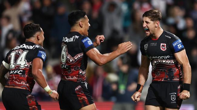 Zac Lomax celebrates victory with his Dragons teammates after beating the Roosters at Netstrata Jubilee Stadium. Picture: Getty Images