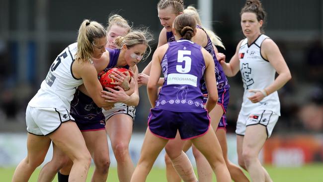 Nikki Gore is wrapped up during the contest between Fremantle and Carlton. Picture: Will Russell/AFL Photos via Getty Images